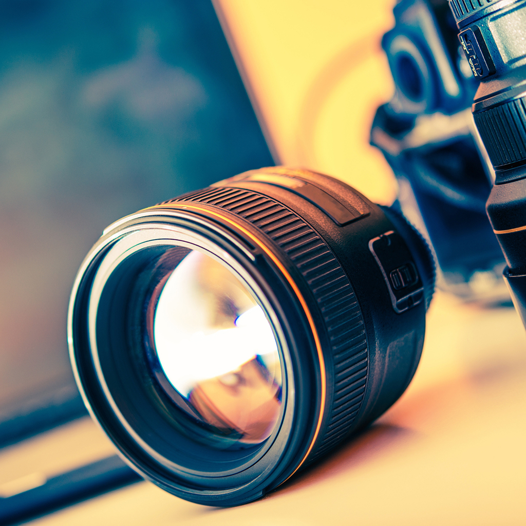 Camera lens on table, close-up view