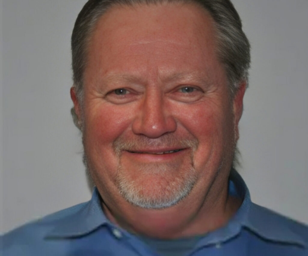 Smiling man in a blue shirt