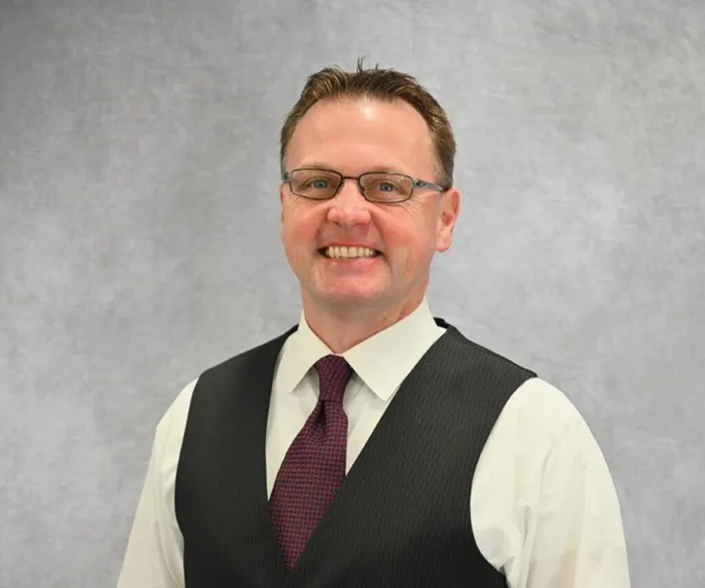 Man wearing glasses and tie